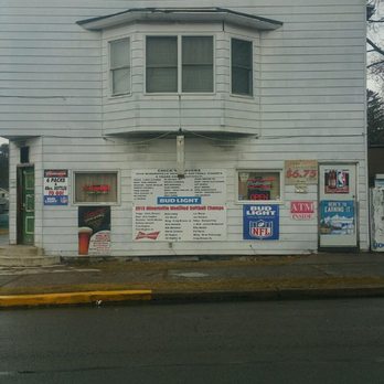 Chicks Cafe - a white building with signs on it - Bars Near Me - Gordon, Pennsylvania