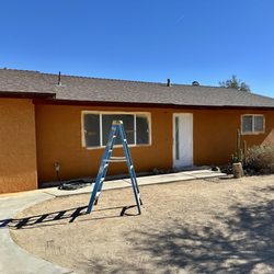 RW Painting - RW Painting - painting the stucco and fascia of our house. Applying elastomeric paint here.