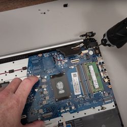 Michael - The Computer Guy - Taking apart a laptop to replace the palm rest