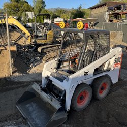 Alans Hauling & Tractor - Skid steer at work