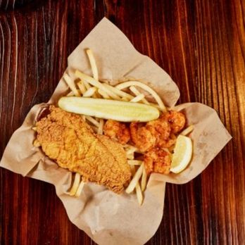 Supreme Crab - a basket of fried fish and french fries - Seafood Near Me - Denton, Texas Supreme Crab - a basket of fried fish and french fries - Seafood Near Me - Denton, Texas