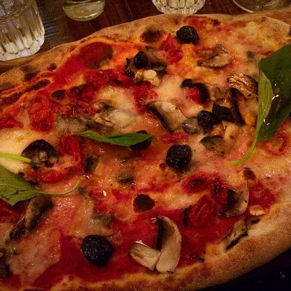 Rustica Pizza w black olives, field mushrooms, coconut mozzarella cheese & balsamic tomatoes (Vegan)