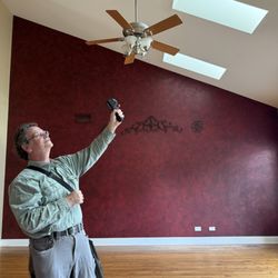 At Home Inspections - Jeff checking ceiling for moisture or leaks.