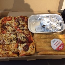 Pizza Hut - The dinner box , pizza, boneless chicken and breadsticks. Good amount for value.