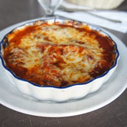 Casa Rugantino - Lasagna layered with ricotta, romano and mozzarella cheese, ham and a meat sauce baked in the oven