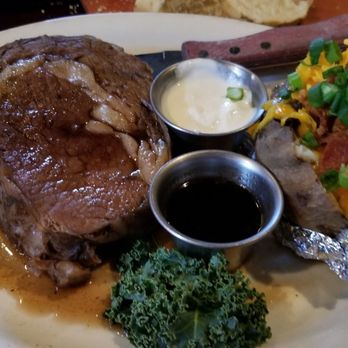 Pelican's - Slow aged medium prime rib with a side of loaded baked potatoe - Steakhouses Near Me - Wichita Falls, Texas Pelican's - Slow aged medium prime rib with a side of loaded baked potatoe - Steakhouses Near Me - Wichita Falls, Texas