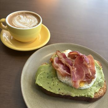 The Pharmacy Coffeehouse - Cornbread Americano and avocado toast topped with bacon and a fried egg. - Coffee & Tea Near Me - Bartlett, Tennessee
