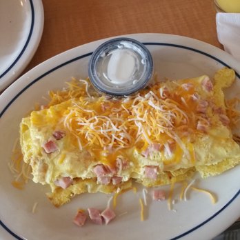 IHOP - Ham and cheese omelet with sour cream on the side. - Breakfast & Brunch Near Me - Hattiesburg, Mississippi IHOP - Ham and cheese omelet with sour cream on the side. - Breakfast & Brunch Near Me - Hattiesburg, Mississippi