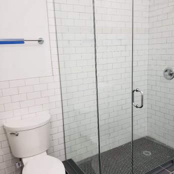 Third Eye Construction - a bathroom with a toilet and shower - General Contractors Near Me Third Eye Construction - a bathroom with a toilet and shower - General Contractors Near Me