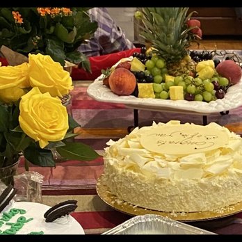 Chocolate Passion Pastry - The white chocolate cake in the center of the table. - Bakeries Near Me - Fairfax, Virginia
