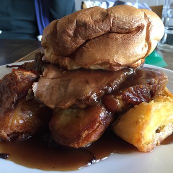 The Bell at Stow - Roast beef/pork, crackling, Apple sauce, goose fat potatoes, Yorkshire pudding, red cabbage, honey roasted roots cauliflower cheese & gravy - Pubs Near Me - Gloucester, STE