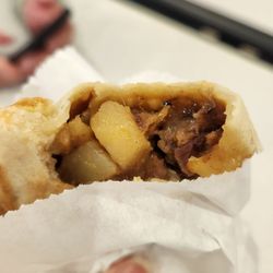 Mamang Sorbetero - Beef empanada: raisins, potato, soft carrots, peas in a stewlike filling.
