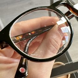 Specsavers - New glasses with dirty lenses and frames, they had dust and white residue from their lab.