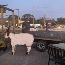 Outside (metallic goat in front of a huge smoker) Outside (metallic goat in front of a huge smoker)