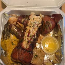 Rusty Shells - Cajun Seafood Boil with lobster, shrimp, sausage, potatoes, and corn