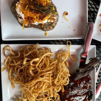 Meritage - Ribeye with loaded potato and onion straws - New American Near Me - Cincinnati, Ohio Meritage - Ribeye with loaded potato and onion straws - New American Near Me - Cincinnati, Ohio