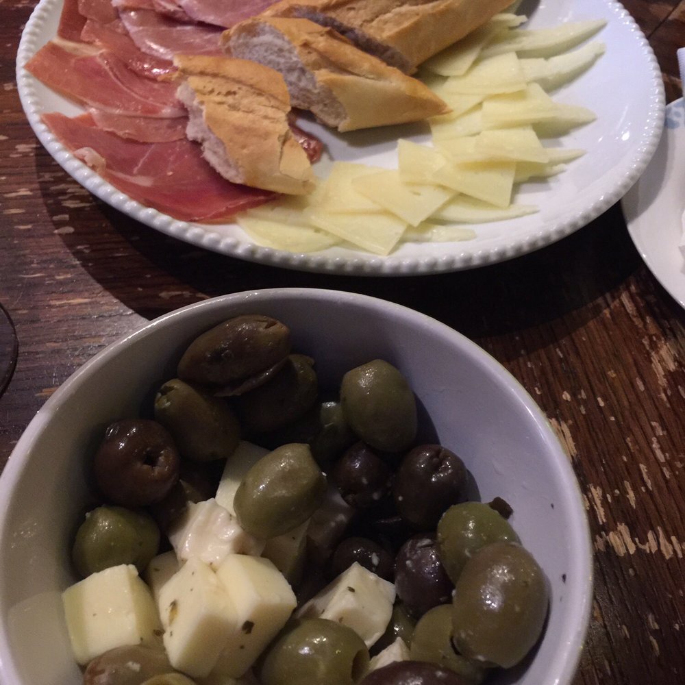 Olives and cheese & Serrano and manchego... good portion size to share. Olives and cheese & Serrano and manchego... good portion size to share.