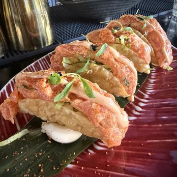 Ceviche 105 - Crispy bites filled with avocado and fresh lettuce. Topped with Nikkei salmon tartar, tobiko and our secret touch. - Peruvian Near Me - Boca Raton, Florida
