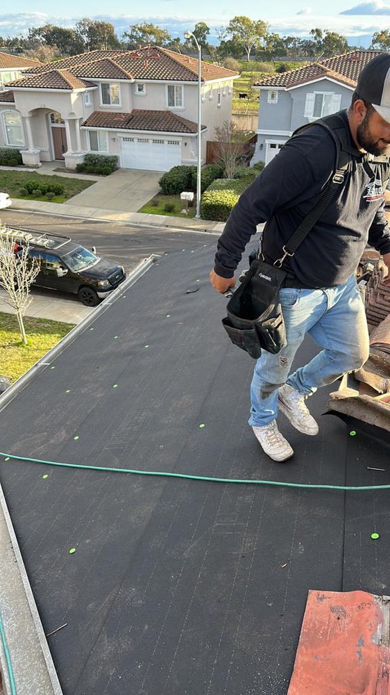 Slide of Husky Roofing