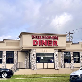 Three Brothers Diner - two cars parked in front of the restaurant - Waffles Near Me - Hamden, Connecticut Three Brothers Diner - two cars parked in front of the restaurant - Waffles Near Me - Hamden, Connecticut