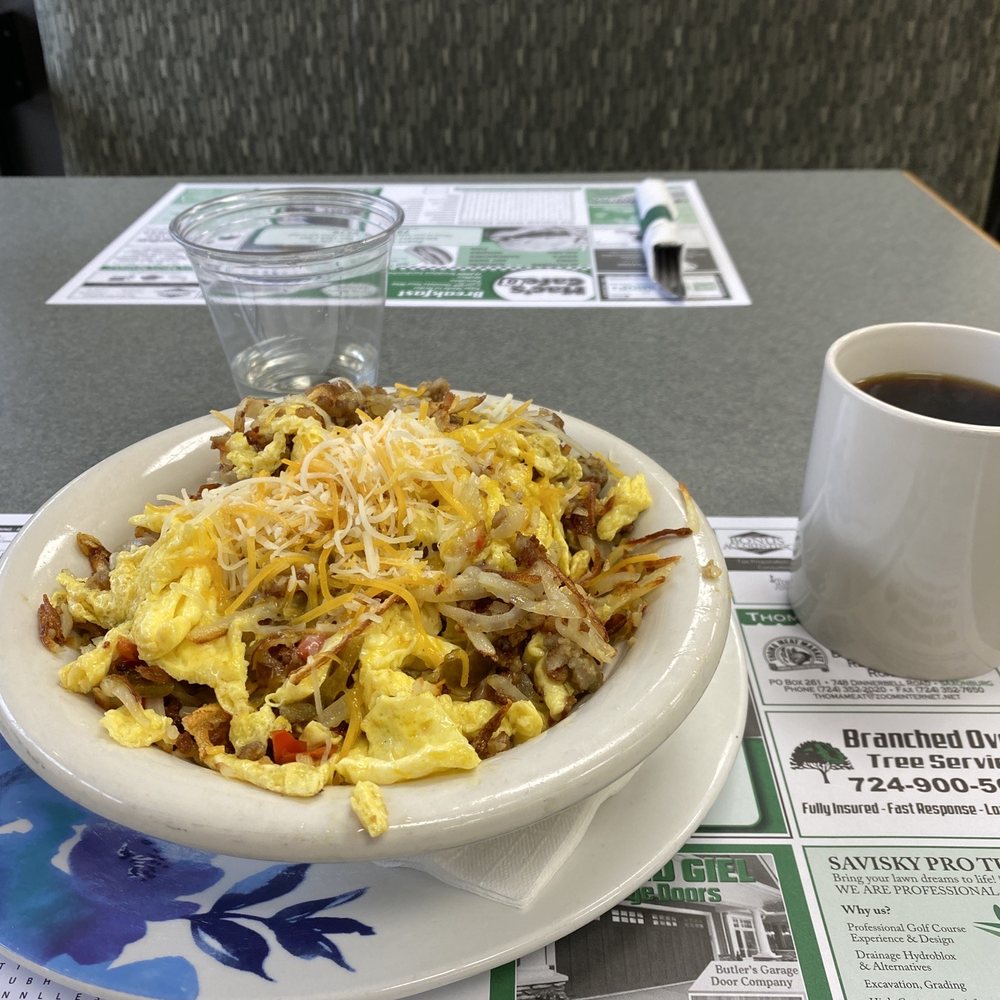 Breakfast bowl with a Coffe and lemon water Breakfast bowl with a Coffe and lemon water