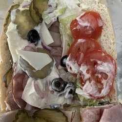 Where is my lettuce and olives? And I had to add the pickles because they were skimping on them alsonever going back!