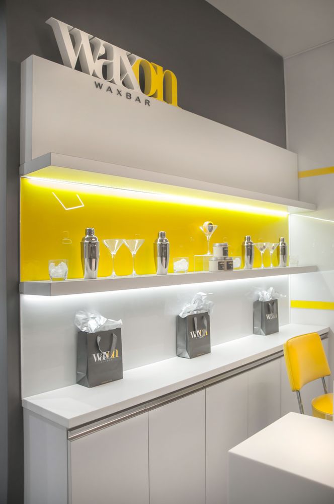 WAXON Laser + Waxbar in Commerce Court Logo