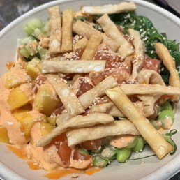 Zucchini Noodles, Salmon, Seaweed Salad, Cucumber, Edamame, Spicy Mayo, Poke Sauce, Sesame Seeds, Wonton Strips, Mango