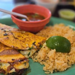 Taquería La Oaxaqueña - Birria Quesadilla with rice and dipping sauce. It's too die for!!!