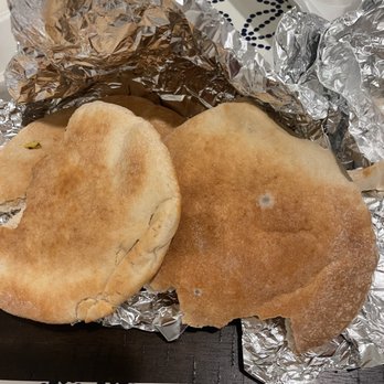 Kebab House - two pieces of bread wrapped in tin foil - Mediterranean Near Me - Orlando, Florida Kebab House - two pieces of bread wrapped in tin foil - Mediterranean Near Me - Orlando, Florida