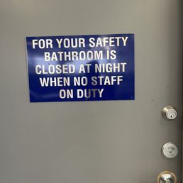 Sign on bathroom door. Showing 'vacant' on door latch. Sign on bathroom door. Showing 'vacant' on door latch.
