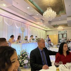 The Bride is in the background @ Wedding