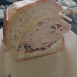 Cross section of the Garlic Herb Turkey + Swiss on Sourdough. Cross section of the Garlic Herb Turkey + Swiss on Sourdough.