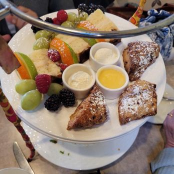 Tea Time - High tea fruit, cake, and scones with clotted cream and lemon curd. - Coffee & Tea Near Me - Palo Alto, California Tea Time - High tea fruit, cake, and scones with clotted cream and lemon curd. - Coffee & Tea Near Me - Palo Alto, California
