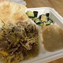 Lamb donair, rice, pita bread, humous, cucumbers