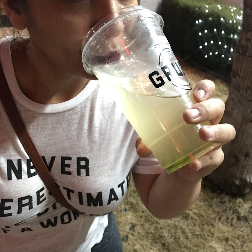 GrubFi - a woman drinking a glass of lemonade - Juice Bars & Smoothies Near Me - El Centro, California GrubFi - a woman drinking a glass of lemonade - Juice Bars & Smoothies Near Me - El Centro, California
