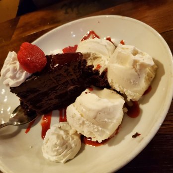 Blast 825 Brewery - 5 layer chocolate cake with berry drizzle... to die for! Our waiter Sebastián gave us extra ice cream since we were sharing! - Brewpubs Near Me - Orcutt, California