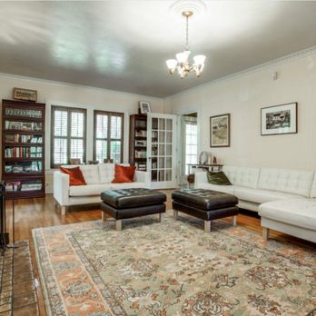 Foreman Coast Living - a living room with a fireplace - General Contractors Near Me Foreman Coast Living - a living room with a fireplace - General Contractors Near Me