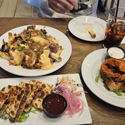 Pork Poutin, hot chicken and pork quesidia.