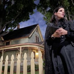 Haunted Orange County - Valerie striking a haunting pose in front of one of the haunted houses in Old town Orange.