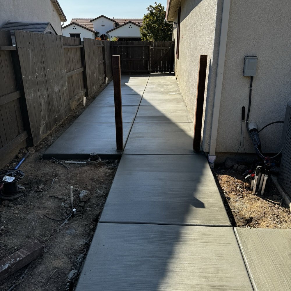 New concrete and posts for the fence and gate. New concrete and posts for the fence and gate.