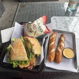 Chicken bacon avo sandwich, pretzels with cheese sauce Chicken bacon avo sandwich, pretzels with cheese sauce
