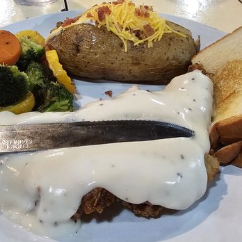 J&D’s Steakhouse - Chicken Fried Steak with fully loaded baked potato. - Seafood Near Me - Sallisaw, Oklahoma J&D’s Steakhouse - Chicken Fried Steak with fully loaded baked potato. - Seafood Near Me - Sallisaw, Oklahoma