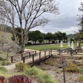 Imagery Estate Winery - Bridge leading to their grassy lawn and outdoor picnic area at Imagery Estate Winery in Glen Ellen. - Wineries Near Me - Glen Ellen, California