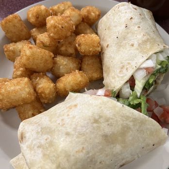 Nashville Biscuit House - Chicken sandwich made into a wrap with tater tots - Southern Near Me - Nashville, Tennessee Nashville Biscuit House - Chicken sandwich made into a wrap with tater tots - Southern Near Me - Nashville, Tennessee