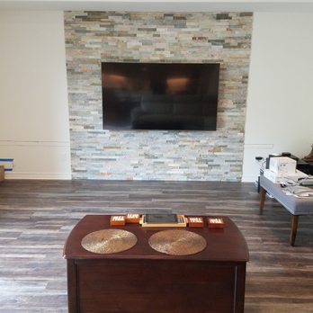 Tile Concept - stacked stone fireplace surround and a wood look porcelain tile floor - Tiling Near Me - Thousand Oaks, California