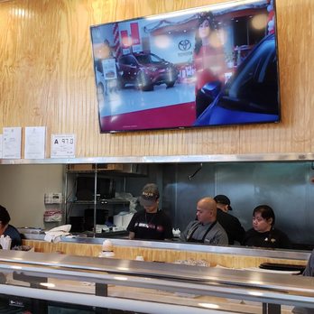 Bachi - The kitchen and big TV in front of the sushi bar. - Sushi Bars Near Me - Charlotte, North Carolina Bachi - The kitchen and big TV in front of the sushi bar. - Sushi Bars Near Me - Charlotte, North Carolina