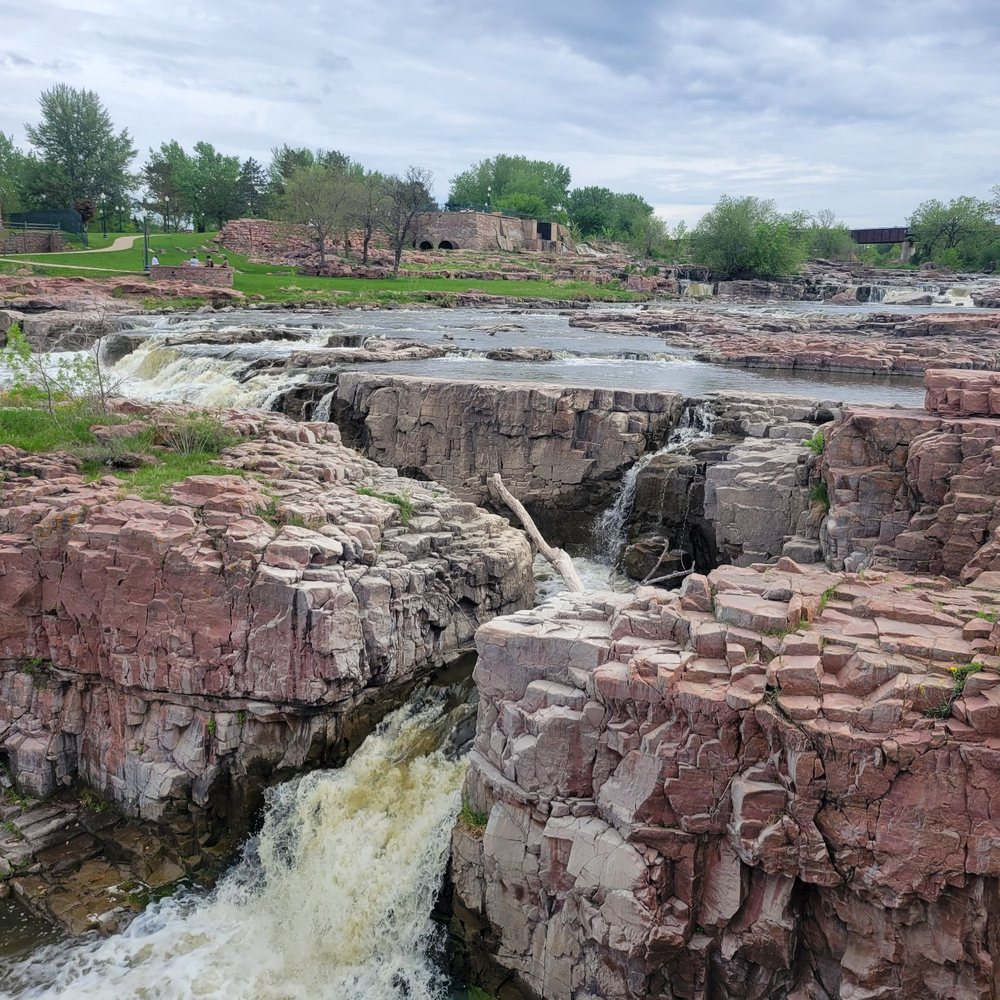 Falls Park - The beautiful Sioux Quartzite carved out by the mighty, Big Sioux River. - Parks Near Me - Sioux Falls, South Dakota Falls Park - The beautiful Sioux Quartzite carved out by the mighty, Big Sioux River. - Parks Near Me - Sioux Falls, South Dakota