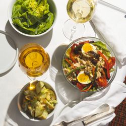 La Pharmacie du Vin - Under the Los Angeles sun, a bright Salade Niçoise, potato salad, and refreshing Salade Verte make for a vibrant and savory lunch affair.
