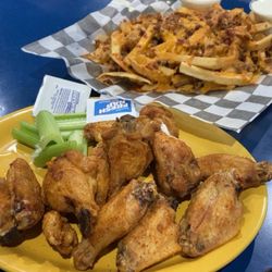 Finnigans Cove Seafood Bar & Grill - Old Bay Wings & Bacon Cheese Fries are perfection